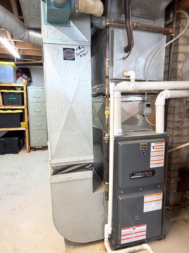 11250 Bristol Rd, Lennon, MI 48449 - utility room featuring heating unit