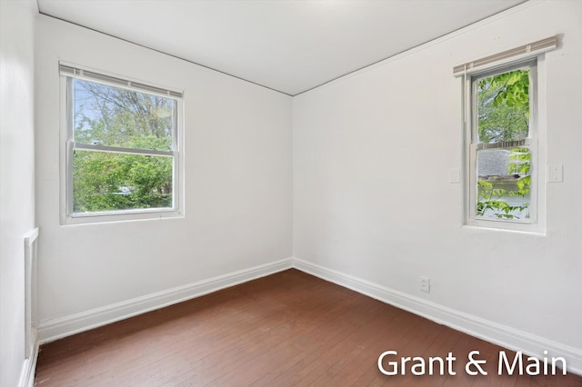19250 Charest St, Detroit, MI 48234 - unfurnished room featuring baseboards and dark wood-style flooring