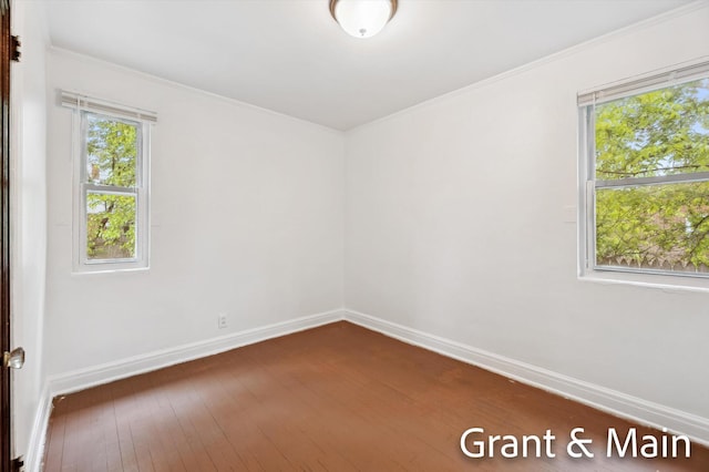 19250 Charest St, Detroit, MI 48234 - empty room featuring baseboards, dark wood finished floors, and crown molding
