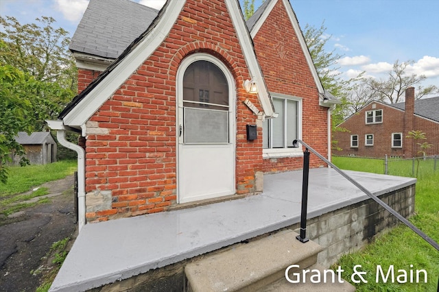 19250 Charest St, Detroit, MI 48234 - property entrance featuring brick siding and roof with shingles