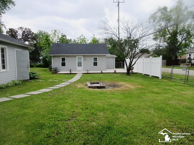 804 Rambow Dr, Monroe, MI 48161 - back of property with an outdoor fire pit and a wooden deck
