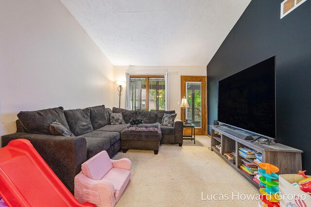 8535 Elkwood Dr SW, Byron Center, MI 49315 - living room featuring vaulted ceiling and carpet