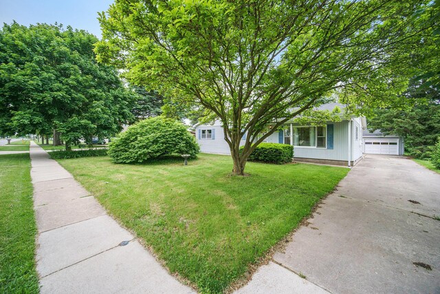 188 Redman Rd, Milan, MI 48160 - view of front of home featuring a front lawn and a garage