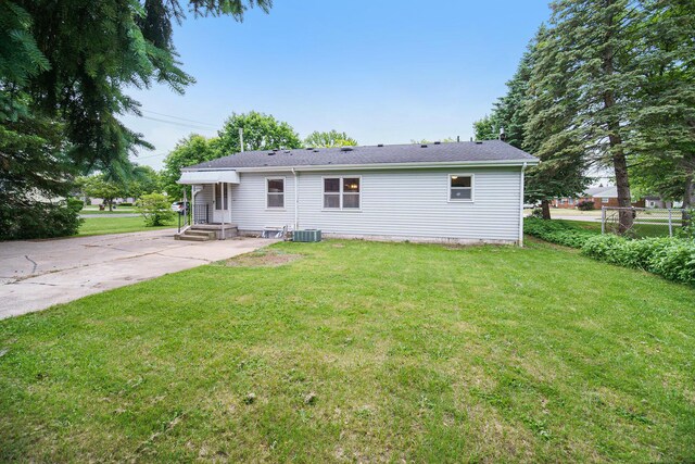 188 Redman Rd, Milan, MI 48160 - back of property featuring a yard and central air condition unit