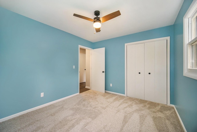 188 Redman Rd, Milan, MI 48160 - unfurnished bedroom featuring carpet, baseboards, a closet, and a ceiling fan