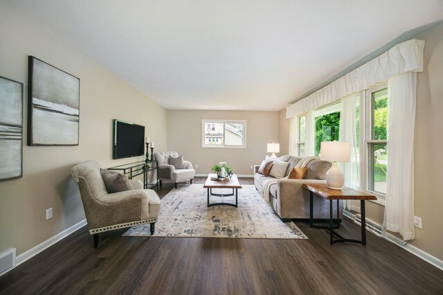 188 Redman Rd, Milan, MI 48160 - living area featuring dark wood-style flooring and baseboards