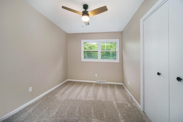 188 Redman Rd, Milan, MI 48160 - unfurnished bedroom featuring carpet floors, baseboards, and ceiling fan