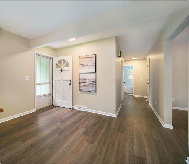 188 Redman Rd, Milan, MI 48160 - foyer entrance with dark wood-style flooring and baseboards