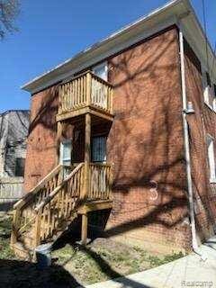 14557 Strathmoor St, Detroit, MI 48227 - rear view of property with a balcony