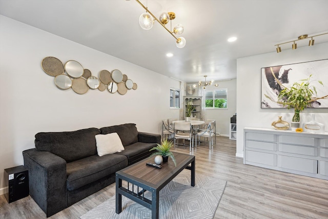 2419 Faye Dr, Ann Arbor, MI 48103 - living area with a chandelier, baseboards, light wood finished floors, and recessed lighting