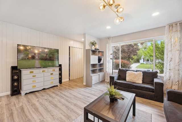 2419 Faye Dr, Ann Arbor, MI 48103 - living area with light wood-style flooring and a chandelier