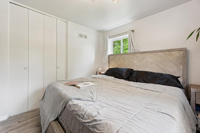 2419 Faye Dr, Ann Arbor, MI 48103 - bedroom with wood finished floors and a closet