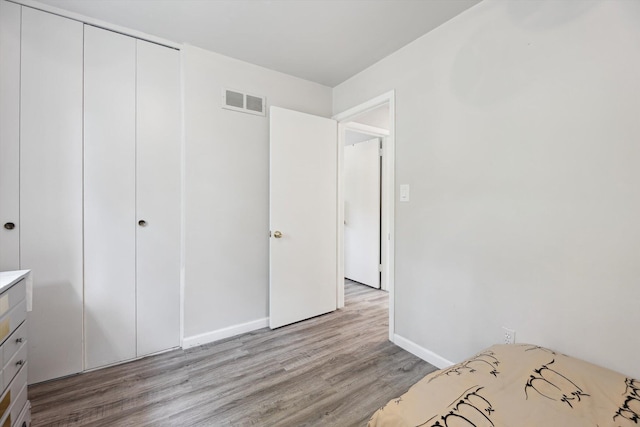 2419 Faye Dr, Ann Arbor, MI 48103 - unfurnished bedroom featuring light wood-type flooring, baseboards, and a closet
