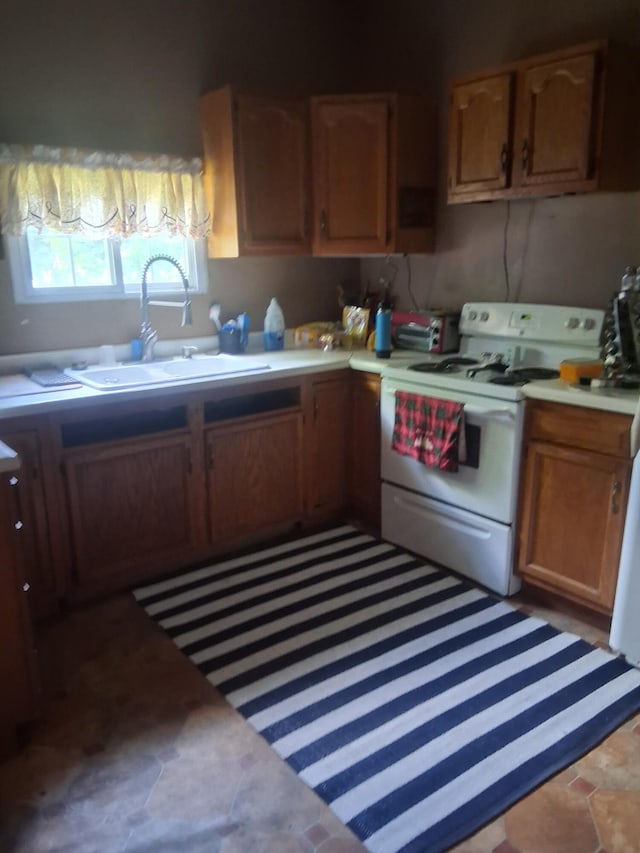 1175 Hammond Rd, Hastings, MI 49058 - kitchen featuring white range with electric stovetop and light countertops