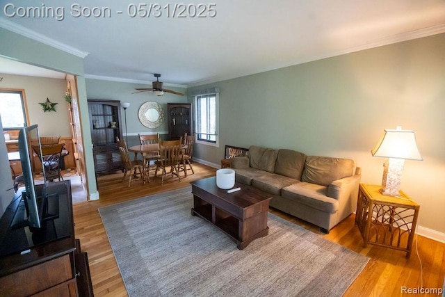 29974 Tamarack Dr, Flat Rock, MI 48134 - living area with wood finished floors, ornamental molding, baseboards, and ceiling fan