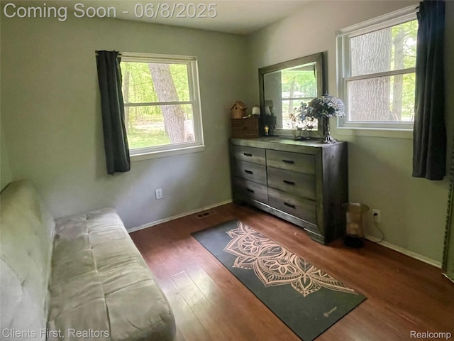 5844 Crandall Rd, Howell, MI 48855 - sitting room with plenty of natural light, dark wood-type flooring, and baseboards