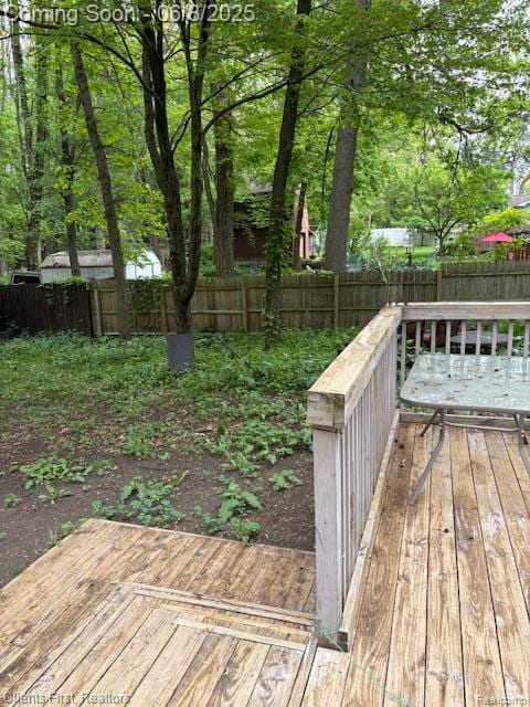 5844 Crandall Rd, Howell, MI 48855 - wooden terrace with a fenced backyard