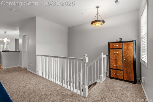 239 Jotham Ave, Auburn Hills, MI 48326 - hall featuring carpet flooring, an upstairs landing, and baseboards