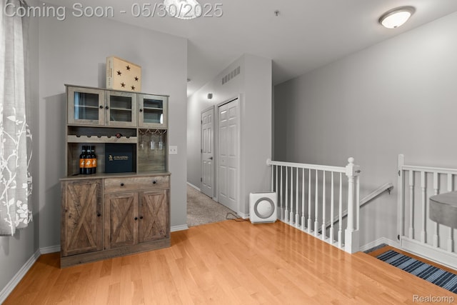 239 Jotham Ave, Auburn Hills, MI 48326 - bar with light wood-style floors and baseboards