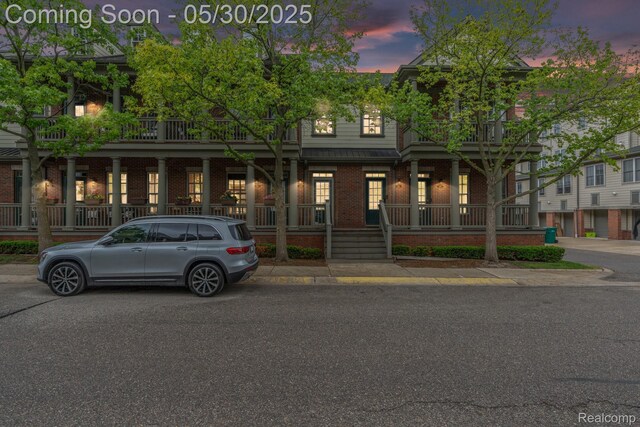 239 Jotham Ave, Auburn Hills, MI 48326 - townhome / multi-family property with brick siding and a porch