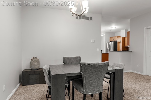 239 Jotham Ave, Auburn Hills, MI 48326 - dining area with light colored carpet, a chandelier, and baseboards