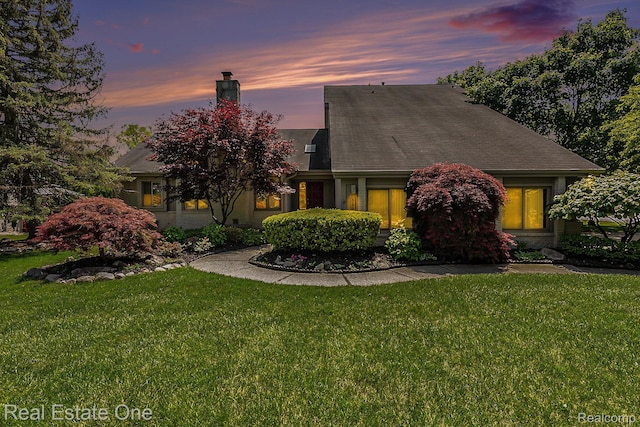 5299 Pond Bluff Dr, West Bloomfield, MI 48323 - view of front of house with a chimney and a front lawn