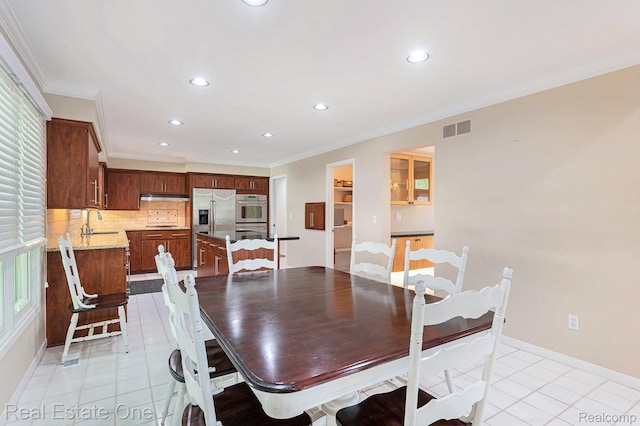 5299 Pond Bluff Dr, West Bloomfield, MI 48323 - dining space featuring light tile patterned flooring, recessed lighting, ornamental molding, and baseboards