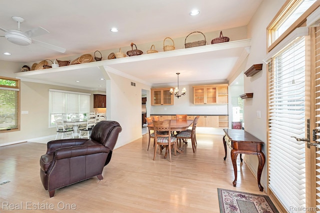 5299 Pond Bluff Dr, West Bloomfield, MI 48323 - dining area featuring light wood finished floors, a chandelier, ceiling fan, ornamental molding, and recessed lighting