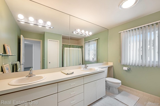 5299 Pond Bluff Dr, West Bloomfield, MI 48323 - full bathroom with double vanity, toilet, tile patterned flooring, a shower with curtain, and baseboards