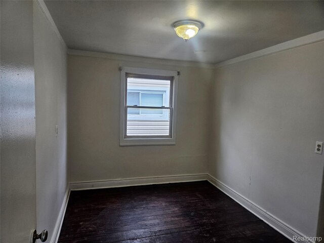 4634 8th St, Ecorse, MI 48229 - unfurnished room with ornamental molding, dark wood-style flooring, and baseboards