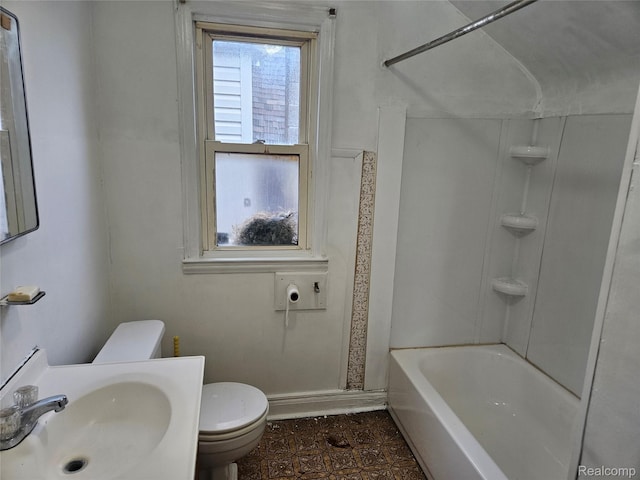 4634 8th St, Ecorse, MI 48229 - full bathroom with toilet, a sink, bathtub / shower combination, and baseboards