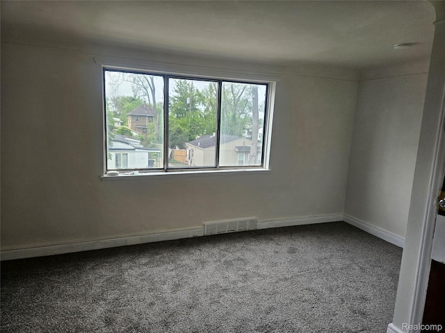 4634 8th St, Ecorse, MI 48229 - empty room featuring carpet flooring and baseboards