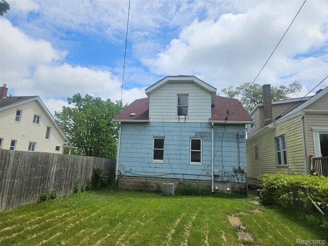 4634 8th St, Ecorse, MI 48229 - rear view of house with roof with shingles and central AC unit