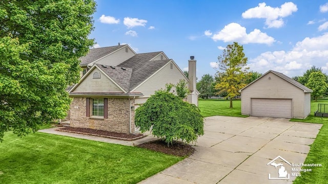 177 W Willis Rd, Saline, MI 48176 - view of home's exterior with a garage, a chimney, a yard, brick siding, and a shingled roof