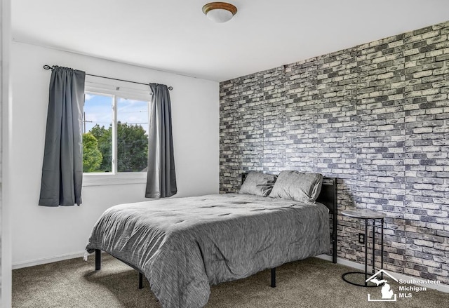 177 W Willis Rd, Saline, MI 48176 - carpeted bedroom featuring baseboards and brick wall