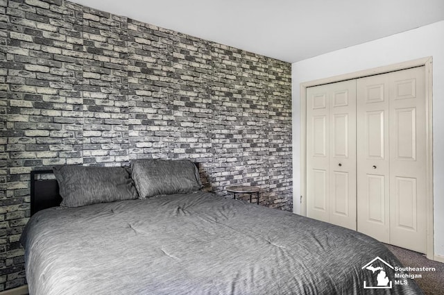177 W Willis Rd, Saline, MI 48176 - bedroom featuring a closet and carpet
