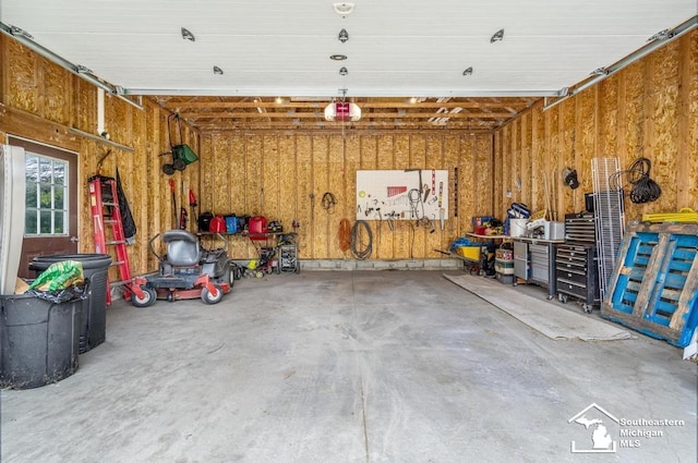 177 W Willis Rd, Saline, MI 48176 - garage featuring a garage door opener