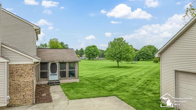 177 W Willis Rd, Saline, MI 48176 - view of grassy yard with a sunroom