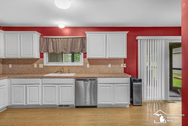 177 W Willis Rd, Saline, MI 48176 - kitchen with stainless steel dishwasher, a sink, and white cabinets