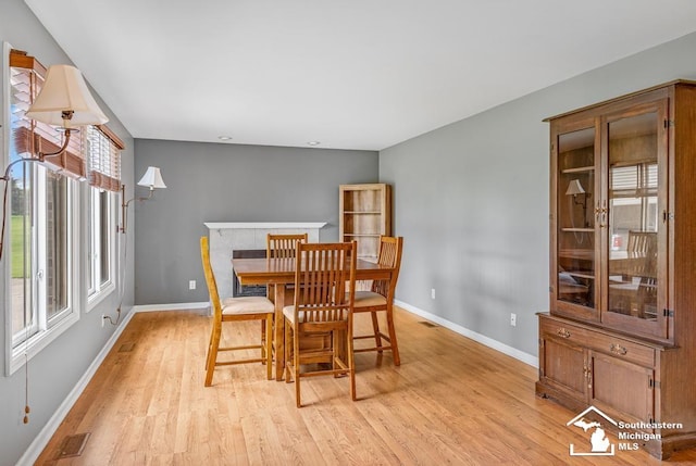 177 W Willis Rd, Saline, MI 48176 - dining room featuring baseboards and light wood-type flooring