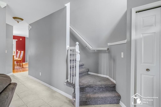177 W Willis Rd, Saline, MI 48176 - stairs featuring tile patterned floors and baseboards