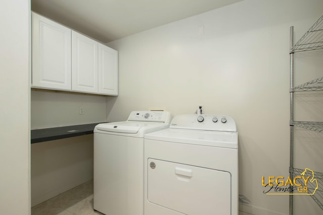 301 Sligh Blvd NE, Grand Rapids, MI 49505 - laundry area with independent washer and dryer and cabinet space