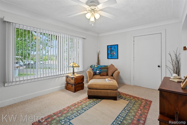634 E Lewiston Ave, Ferndale, MI 48220 - sitting room with a ceiling fan, carpet flooring, baseboards, and a textured ceiling