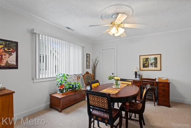 634 E Lewiston Ave, Ferndale, MI 48220 - dining space with light carpet, crown molding, a ceiling fan, baseboards, and a textured ceiling