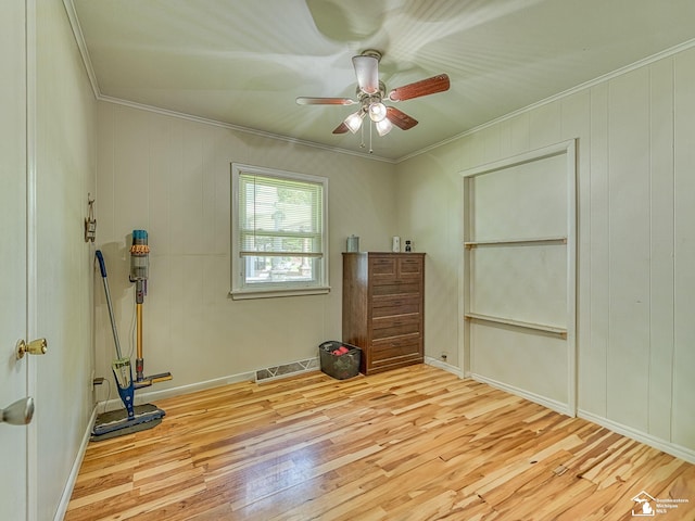 424 W 4th St, Monroe, MI 48161 - unfurnished bedroom featuring light wood-style flooring, ornamental molding, a ceiling fan, and baseboards