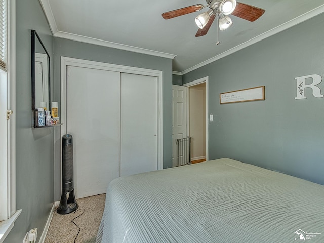 424 W 4th St, Monroe, MI 48161 - carpeted bedroom featuring ornamental molding, a closet, a ceiling fan, and baseboards