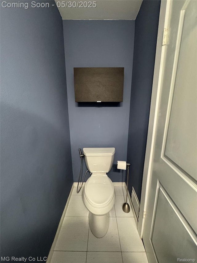 271 Inlet Ct, Novi, MI 48390 - bathroom with tile patterned floors, toilet, and baseboards