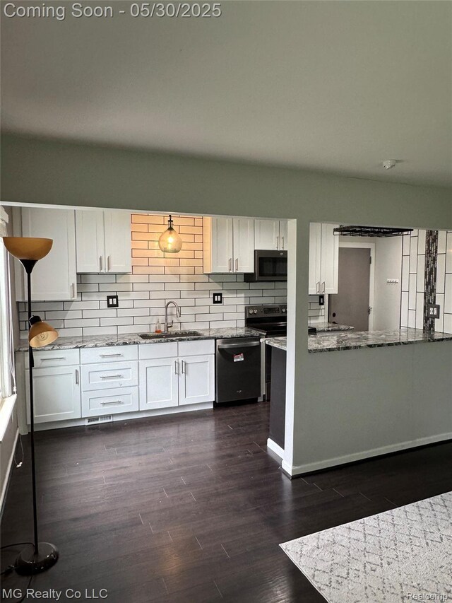 271 Inlet Ct, Novi, MI 48390 - kitchen with stainless steel appliances, a sink, and white cabinetry