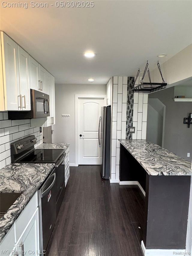 271 Inlet Ct, Novi, MI 48390 - kitchen featuring black appliances, stone countertops, dark wood finished floors, white cabinetry, and recessed lighting