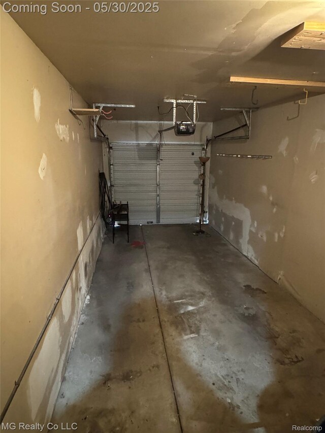 271 Inlet Ct, Novi, MI 48390 - garage featuring a garage door opener